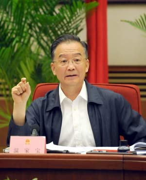 Chinese Premier Wen Jiabao speaks on the quake relief work during a meeting of the State Council, in Beijing, capital of China, May 21, 2008. 